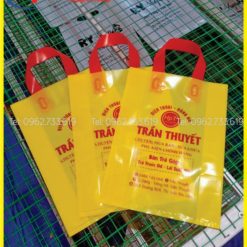 Túi pe vàng quai ép đỏ